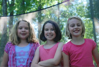 Kylie, Paige, and Naomi on the trampoline