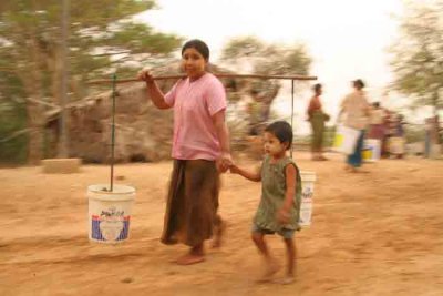 Burma-Mother and child carrying water-1.jpg
