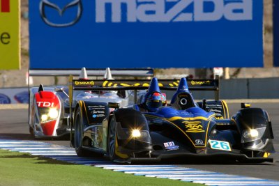 AGR Acura and Audi R10 accelerating out of T11