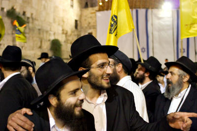 Enjoying themselves by the Western Wall