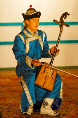 A musician plays a Morin Khuur (traditional horse-head violin), Tumen Ekh National Performers