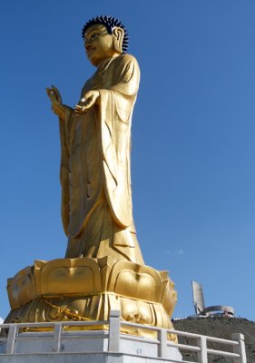 Mongolia's present and past -- a new statute of Buddha, with the Zaisan Memorial in the background