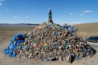 Roadside monument to local spirits.  Mongolian drivers honk as they drive by to pay their respects.