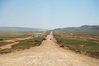 Road to Ulaanabaatar.  The main road is under construction, so cars must drive on the roads on either side.