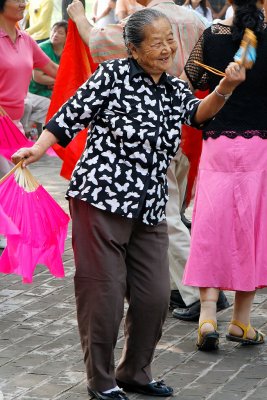 A woman dancing in Temple of Heaven Park