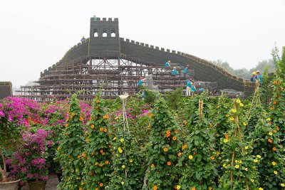 Flowers and a great wall replica for an upoming celebration, Tiananmen Square