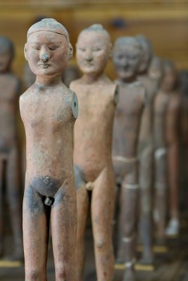 These figures had wooden arms and fabric clothing, which disintegrated over time.