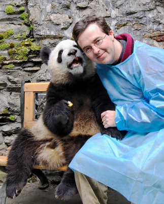 Chris with a panda cub, Wolong