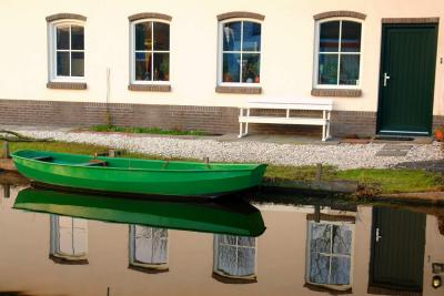 Green boat reflection