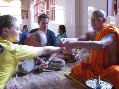 Getting blessed by the monk before our trip in Phnom Pehn