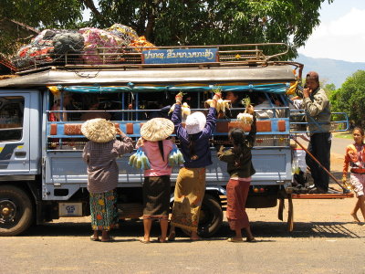 Vendors mobbing the bus- they never do that for me, and I'm a lot hungrier riding my bike!