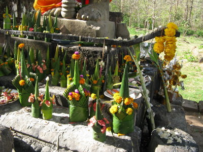 Offerings at the foot of Buddha