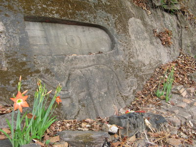 Footprint of the Buddha and elephant carved into the cliff