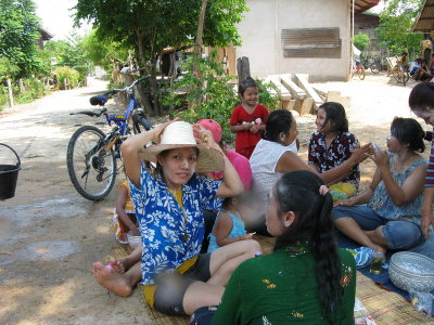 Celebrating the New Year by drinking, eating, and waterfighting on the street near Pen's house