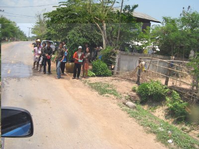 Adults on the street throwing water