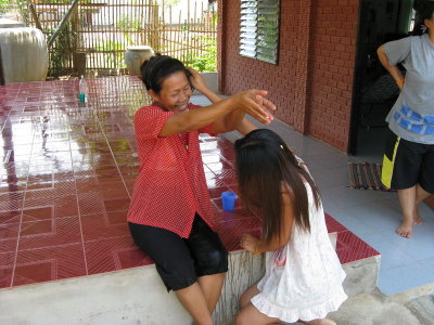 Pen and her mother splashing each other
