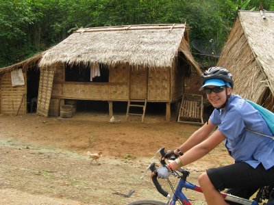 Riding through a rural village- in this area, thatch huts were the norm.