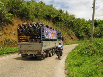 The future is coming- truckloads of scooters and motorcycles. Laos is not over-run like Thailand, yet...