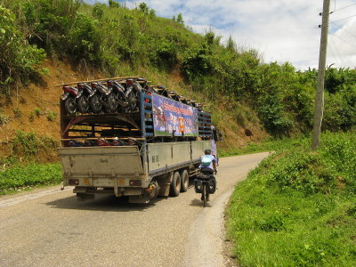 The future is coming- truckloads of scooters and motorcycles.  Laos is not over-run like Thailand, yet...