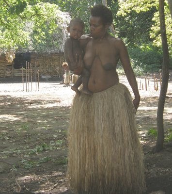 Yakel woman carrying a child