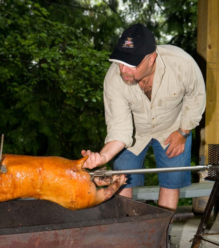 Again... what is Rick doing to the hog?