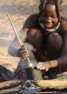Himba Girl making poridge, Serra Cafema 13