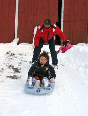 Sleding down the barn hill *