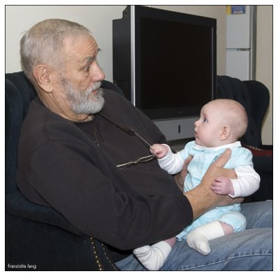 Grandpa and Vivian pull faces at each other