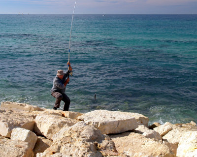 man fishing with fish.JPG