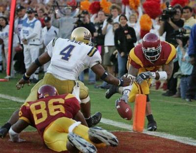 LenDale White carries in for a touchdown as Jarrad Page looks on.jpg