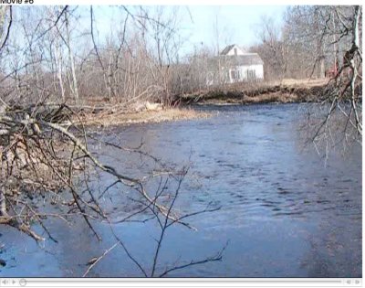 little island in midstream, and house on far shore