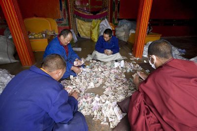 Counting the day offerings inside Jokhang
