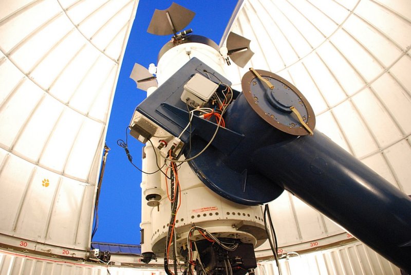 THE HUGE ARM SUPPORTS THE TELESCOPE AND IS COUNTER BALANCED BY A HUGE WEIGHT