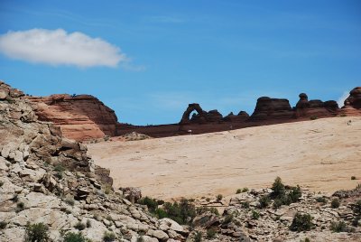 AS WE DROVE DEEPER INTO THE PARK WE SAW THE PETRIFIED SAND DUNES AND OUR FIRST ARCH IN THE BACKGROUND