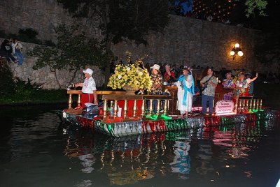 MANY OF THE FLOATS WERE DECORATED WITH YELLOW ROSES