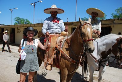 SARA GREETED TWO CHARROS AFTER THE CHARREADA AND THANKED THEM AND THEIR HORSES FOR THE SHOW