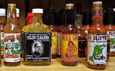 A CLOSE UP OF THE ENDLESS HOT SAUCES