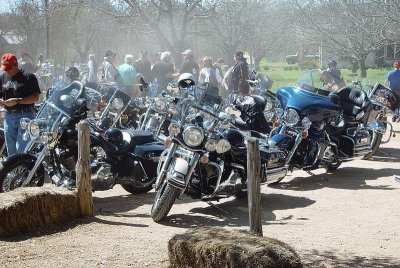 THE BIKERS OFTEN ARRIVE IN A CLOUD OF DUST AND A MIGHTY ROAR