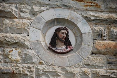THIS IMAGE OF CHRIST WAS BUILT RIGHT INTO THE STONE FACADE
