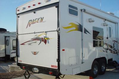 THIS IS TOY HAULER-DOOR DROPS DOWN TO UNLOAD CYCLES OR ATVS