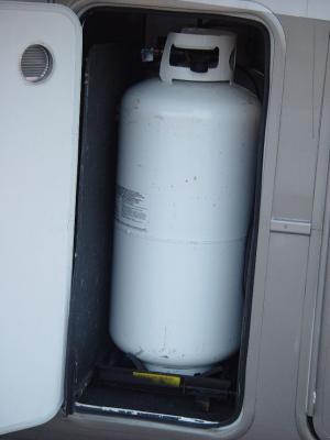 THERE ARE TWO 40 GALLON PROPANE TANKS IN THIS COMPARTMENT