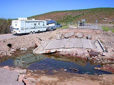 A WASHOUT AND TEMPORARY ROAD TO THE SIDE