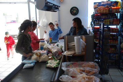 THE CHECKOUT LINES WERE OFTEN LONG AND EVERYONE BOUGHT TORTILLAS