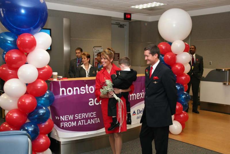 Gate activity prior to inaugural Delta flight from Atlanta to Acapulco