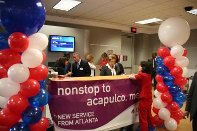 Gate activity prior to inaugural Delta flight from Atlanta to Acapulco