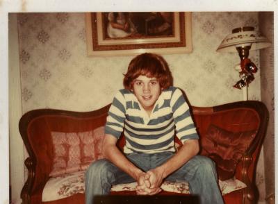 Billy sitting on couch that never gets sat on, 1977