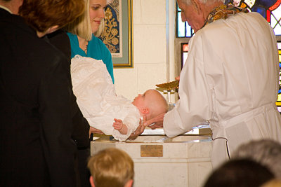 I baptize thee in the name of the Father.....