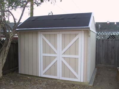 Added rain gutters to siphon flow toward the fence.