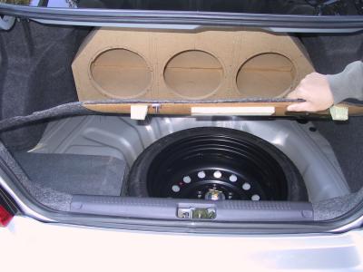 Note that the spare tire is accessible WITHOUT removing the enclosure; very important!