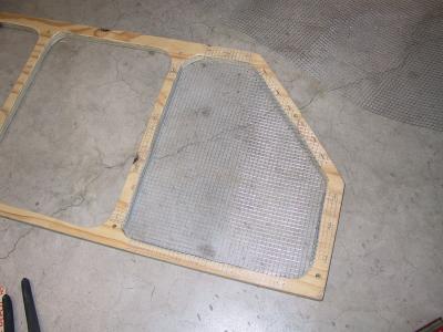 First piece of formed wire mesh installed to the grill frame. Mesh installed from the inside.